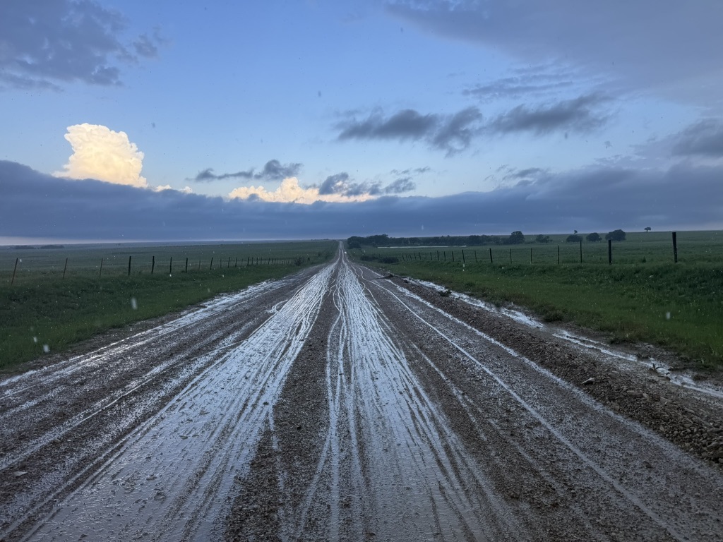 A long muddy gravel road during Unbound XL